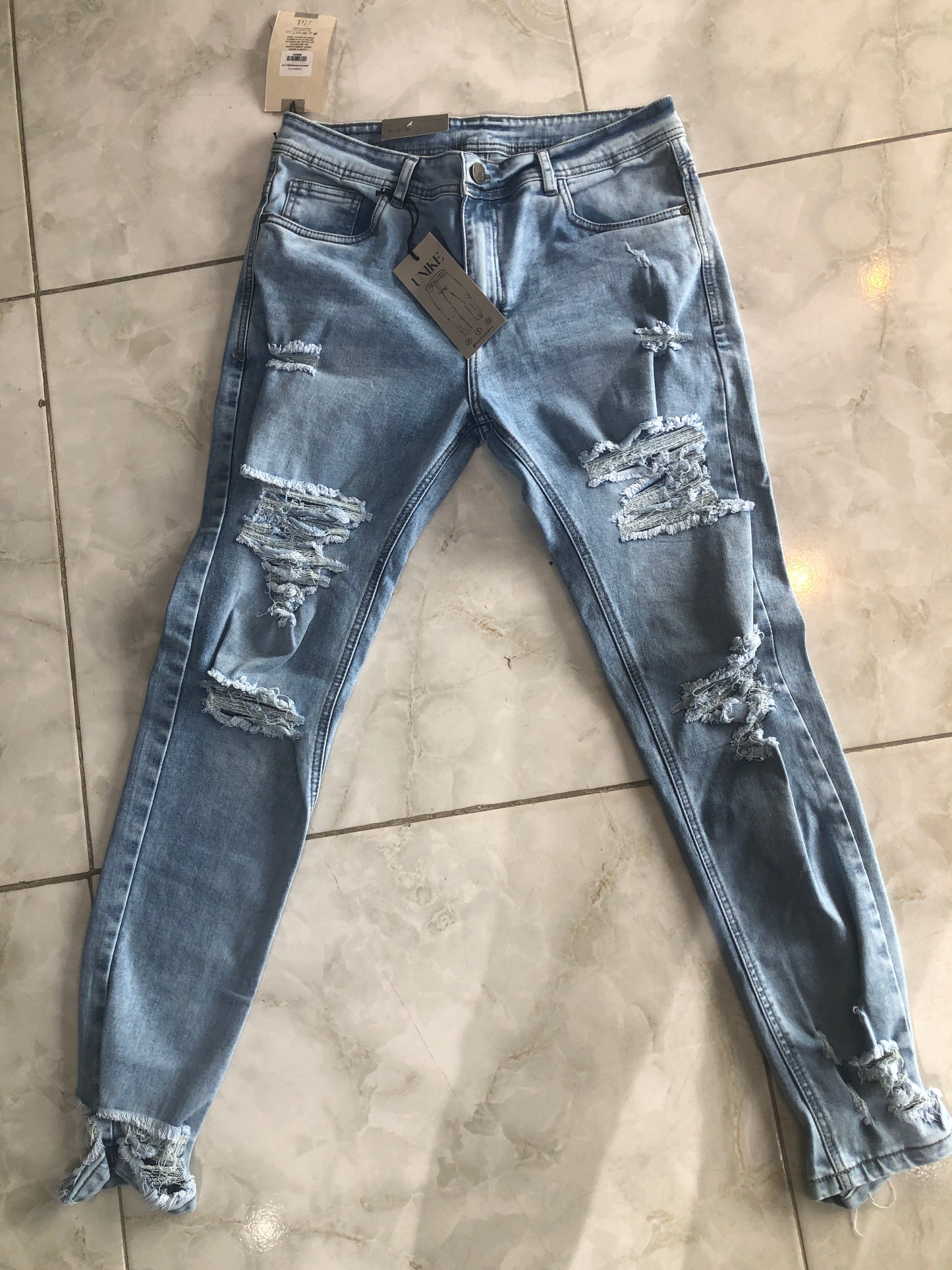 Jean caballero azul claro roto bolsillo liso