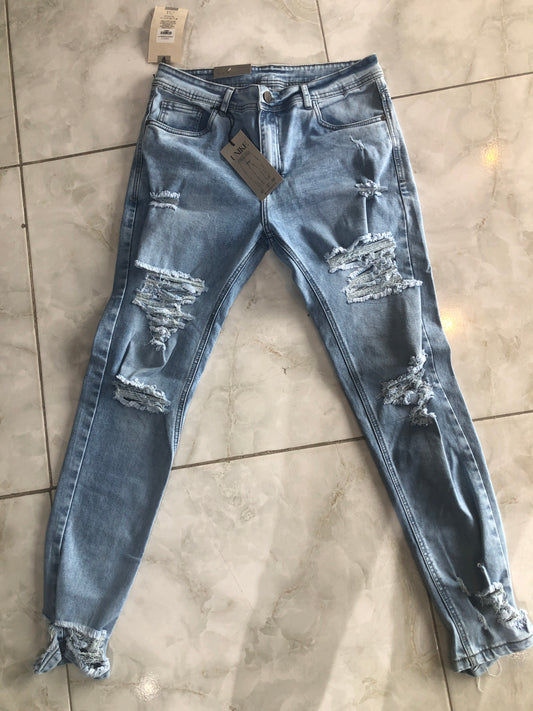 Jean caballero azul claro roto bolsillo liso