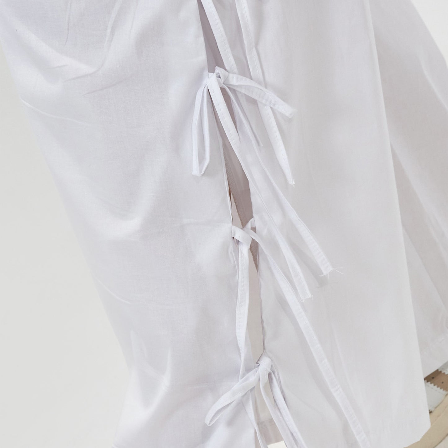 Pantalón lazos tela